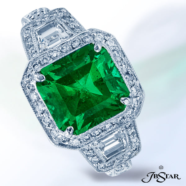 JB STAR A GLOWING 3.45 CT. EMERALD CUT EMERALD IS FRAMED BY SPARKLING .67 CT. TW. TRAPEZOID CUT AND
