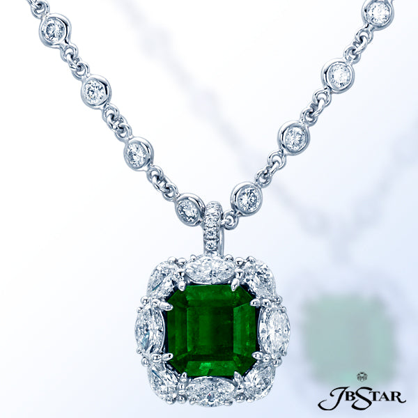 JB STAR A BEAUTIFUL EMERALD-CUT EMERALD PENDANT EMBRACED BY MARQUISE AND PEAR-SHAPE DIAMONDS; HANDCR