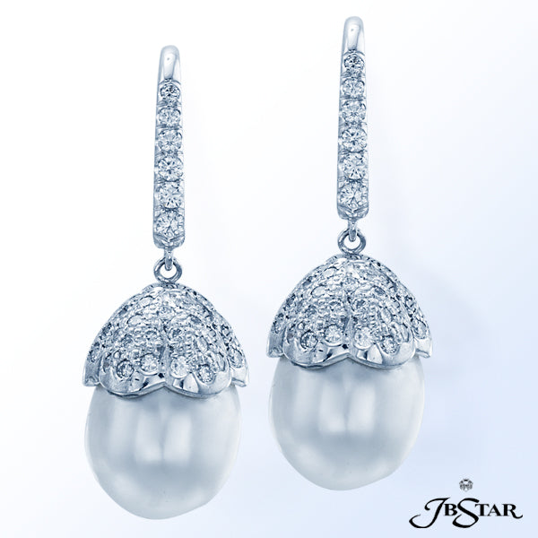 JB STAR STUNNING EARRINGS FEATURING 2 PEARLS FROM THE SOUTH SEA WITH ROUND DIAMONDS SET IN PLATINUM.