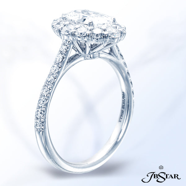 JB STAR DIAMOND RING EXQUISITELY DESIGNED WITH A 1.22CT OVAL DIAMOND ENCIRCLED BY ROUND BRILLIANT DI