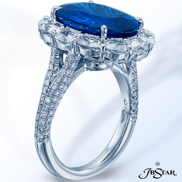 JB STAR SAPPHIRE AND DIAMOND RING WITH A STUNNING 8.49 CT OVAL BLUE SAPPHIRE ENCIRCLED BY 12 OVAL DI