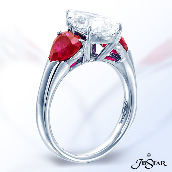 JB STAR GORGEOUS AND UNIQUE DIAMOND AND RUBY RING FEATURING A 2.50CT PEAR SHAPE DIAMOND CENTER EMBRA