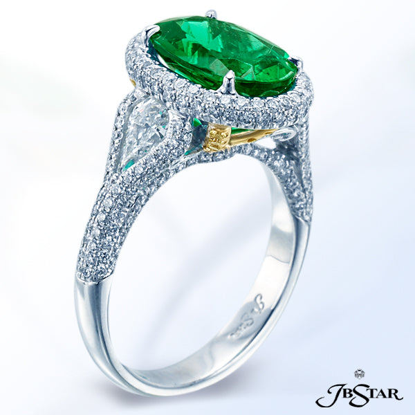 JB STAR EMERALD RING HANDCRAFTED WITH A STUNNING 2.47 CT OVAL EMERALD EMBRACED BY SHIELD SHAPE DIAMO