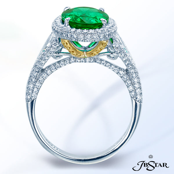 JB STAR EMERALD RING HANDCRAFTED WITH A STUNNING 2.47 CT OVAL EMERALD EMBRACED BY SHIELD SHAPE DIAMO