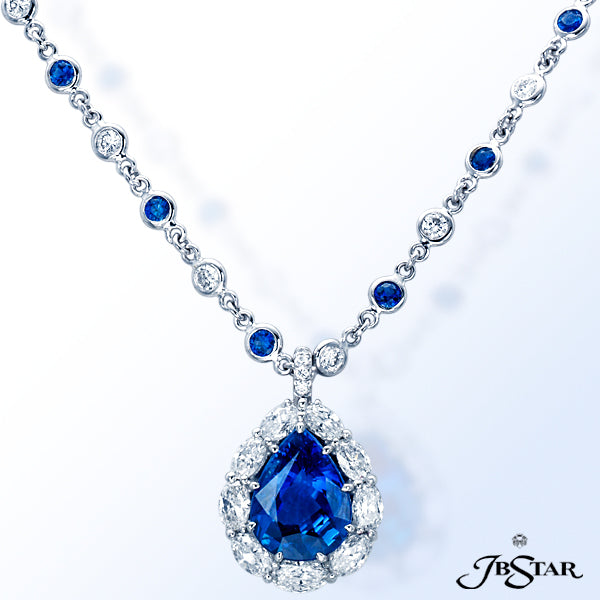 JB STAR SAPPHIRE PENDANT FEATURING A BEAUTIFUL 6.24 CT PEAR SHAPE BLUE SAPPHIRE ENCIRCLED BY OVAL DI