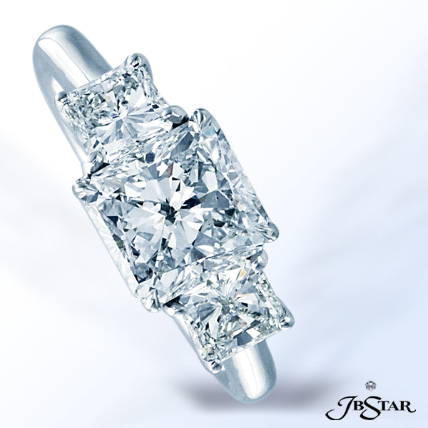 JB STAR DIAMOND RING FEATURING A STUNNING RADIANT-CUT 2.01 CT DIAMOND EMBRACED BY PRINCESS-CUT DIAMO