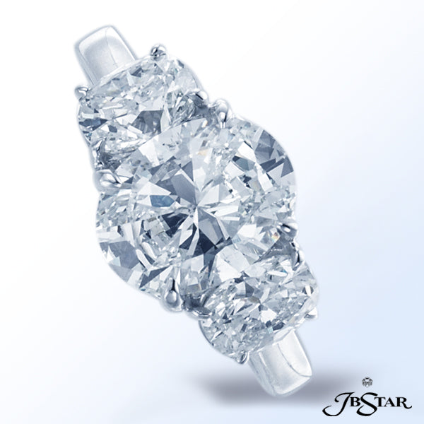 JB STAR DIAMOND ENGAGEMENT RING FEATURING A BEAUTIFUL 2.0 CT OVAL DIAMOND EMBRACED BY CUSHION DIAMON