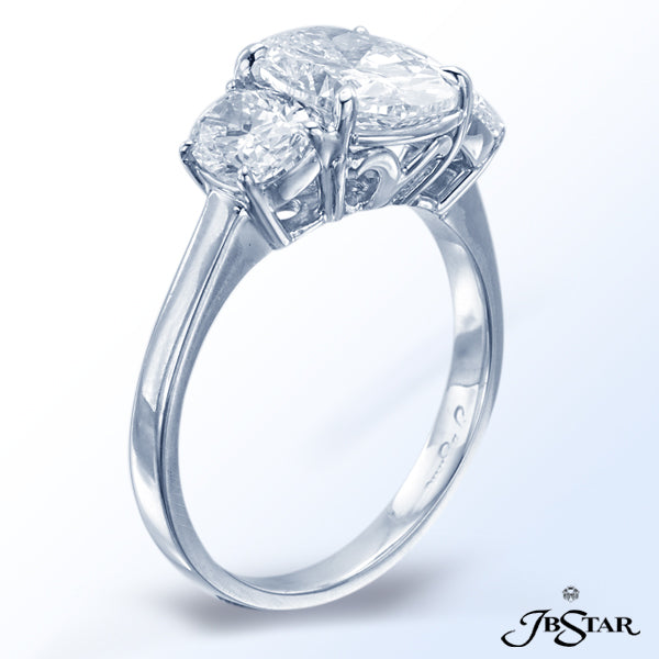 JB STAR DIAMOND ENGAGEMENT RING FEATURING A BEAUTIFUL 2.0 CT OVAL DIAMOND EMBRACED BY CUSHION DIAMON