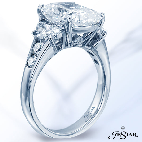 JB STAR DIAMOND RING CLASSICALLY DESIGNED IN 3-STONE STYLE WITH A BEAUTIFUL 5.05 CT CUSHION CENTER D
