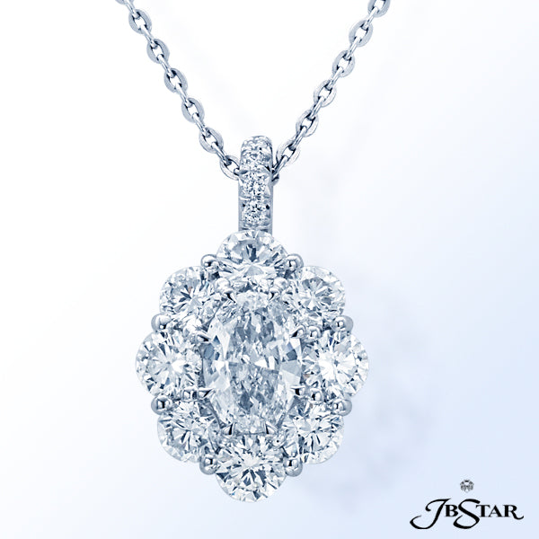 JB STAR DIAMOND PENDANT FEATURING A 1.00 CT OVAL DIAMOND ENCIRCLED BY 8 PERFECTLY MATCHED ROUND DIAM