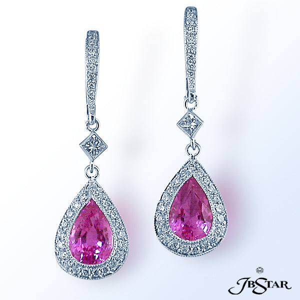 JB STAR TWO VIVID PEAR SHAPE 3.45 CT. TW. PINK SAPPHIRES ARE SUPPORTED BY A SPARKLING BLEND OF .17 C