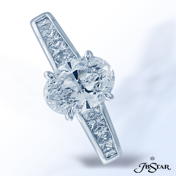 JB STAR PLATINUM DIAMOND RING FEATURING A STUNNING 1.50 CT OVAL DIAMOND ACCENTED BY 10 PRINCESS-CUT