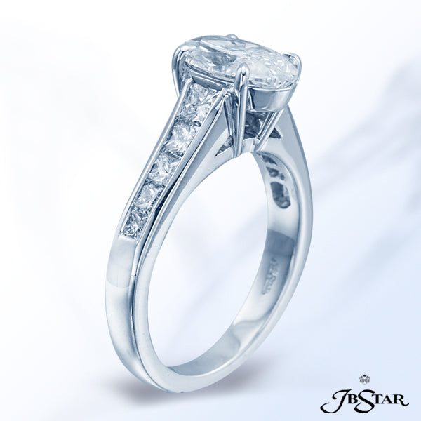 JB STAR PLATINUM DIAMOND RING FEATURING A STUNNING 1.50 CT OVAL DIAMOND ACCENTED BY 10 PRINCESS-CUT