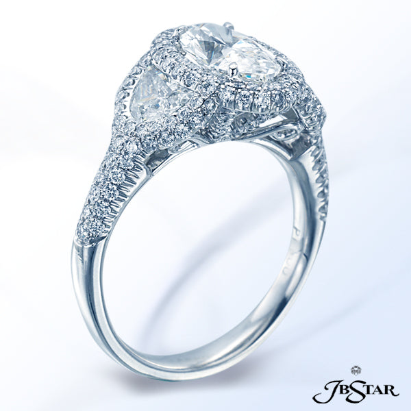 JB STAR PLATINUM DIAMOND RING FEATURING A STUNNING 1.42 CT OVAL DIAMOND EMBRACED BY TWO HALF MOON DI