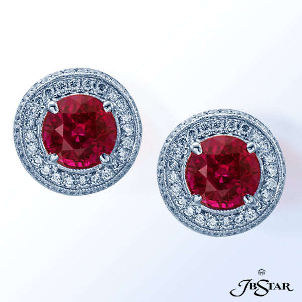 JB STAR THESE EXQUISITE EARRINGS FEATURE PERFECTLY MATCHED ROUND RUBIES WITH A PAVE DIAMOND EMBRACE.