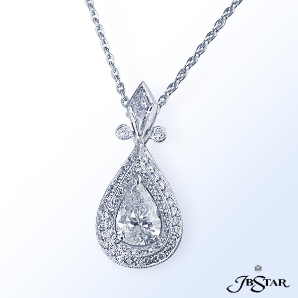JB STAR A STRIKING 1.05 CT. PEAR SHAPE DIAMOND IS DELICATELY FRAMED BY TWO ROWS OF SPARKLING .33 CT.