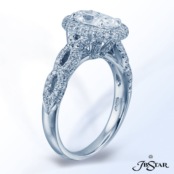 JB STAR DIAMOND RING FEATURING A MAGNIFICENT 1.52 OVAL CENTER IN A MICRO PAVE HALO SETTING, ACCENTED