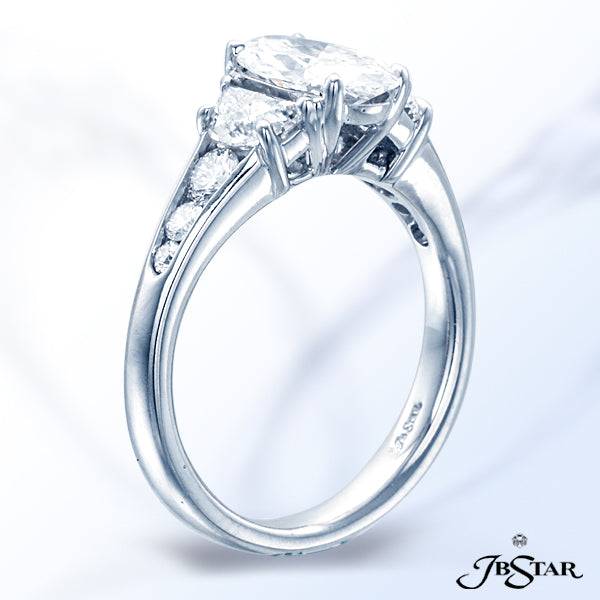 JB STAR STUNNING HANDCRAFTED RING FEATURING A 1.13CT OVAL DIAMOND WITH HALF MOON DIAMOND AND ROUND D