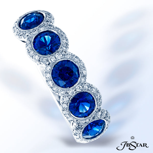 JB STAR THIS STUNNING PLATINUM SAPPHIRE AND DIAMOND BAND FEATURES 5 ROUND SAPPHIRES EMBRACED WITH PA