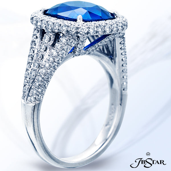 JB STAR PLATINUM RING FEATURING A BEAUTIFUL 5.13 CT CUSHION SAPPHIRE IN A MICRO PAVE HALO SETTING WI