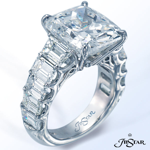 JB STAR DIAMOND RING FEATURING AN AMAZING 10.40 CT CUSHION DIAMOND EMBRACED BY TRAPEZOID DIAMONDS AN