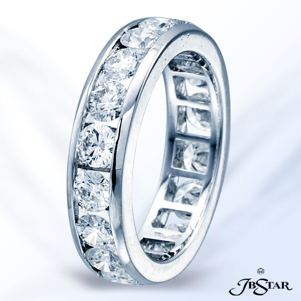 JB STAR PLATINUM DIAMOND ETERNITY BAND HANDCRAFTED WITH 18 ROUND DIAMONDS IN A CHANNEL SETTING.DIA