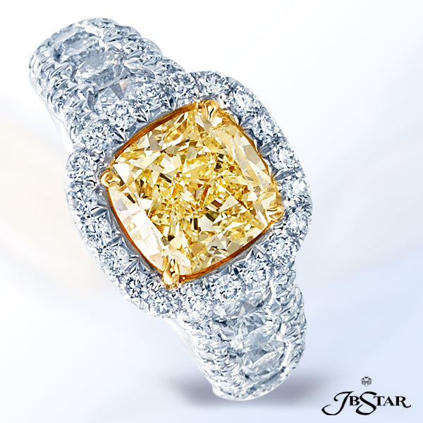 JB STAR PLATINUM DIAMOND RING FEATURING A CUSHION-CUT FANCY YELLOW DIAMOND, SET IN A MICRO PAVE HALO