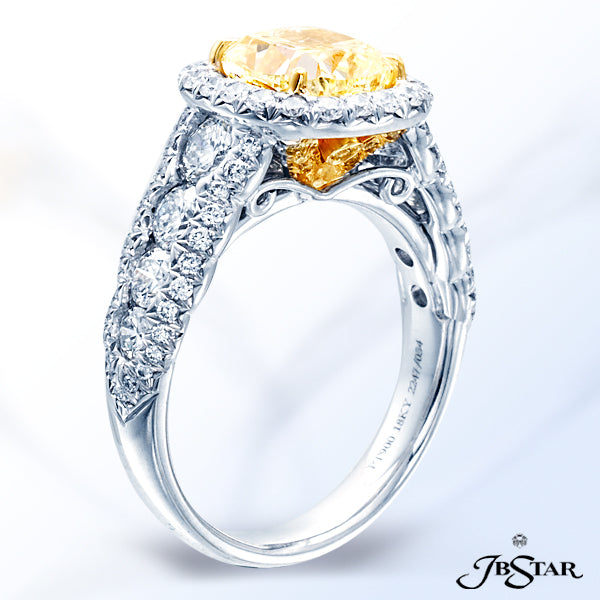 JB STAR PLATINUM DIAMOND RING FEATURING A CUSHION-CUT FANCY YELLOW DIAMOND, SET IN A MICRO PAVE HALO