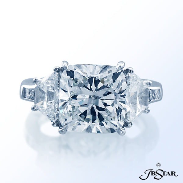 JB STAR DIAMOND RING IN A CLASSICALLY DESIGNED WITH A 5.02 CT CUSHION DIAMOND CENTER EMBRACED BY PER
