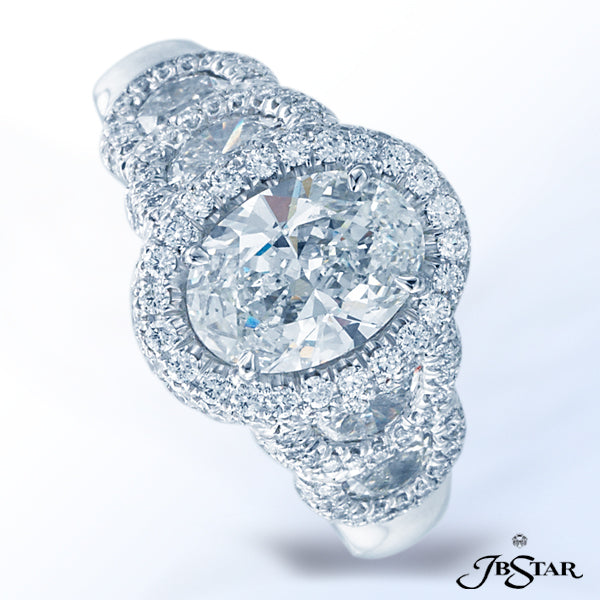 JB STAR HANDCRAFTED PLATINUM AND DIAMOND RING FEATURING A 1.52CT OVAL DIAMOND WITH HALF MOON DIAMOND