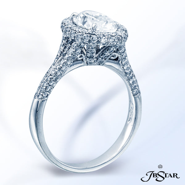 JB STAR STUNNING 1.52CT OVAL DIAMOND RING EDGED IN PAVE AND SET IN PLATINUM.CENTER: OVAL 1.52CT E