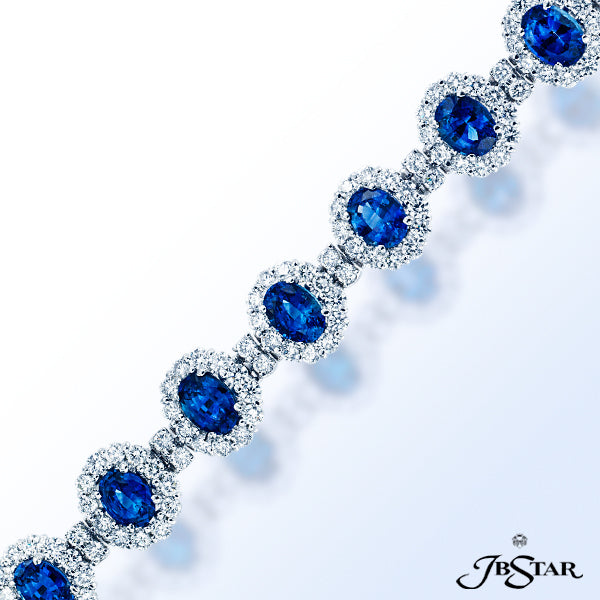 JB STAR AN ASTOUNDING ARRAY OF 12 VIBRANT OVAL SHAPE BLUE SAPPHIRES ARE FEATURED AMID ROUND DIAMONDS