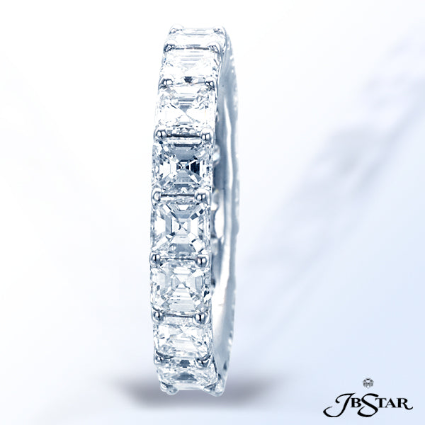 JB STAR THIS EXQUISITELY HANDCRAFTED, PLATINUM, ETERNITY BAND FEATURES 18 SQUARE EMERALD-CUT DIAMOND