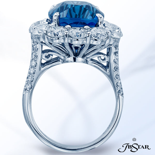 JB STAR HANDCRAFTED, THIS STUNNING RING FEATURES A 16.69CT NO HEAT SAPPHIRE CUSHION CENTER ENCIRCLED