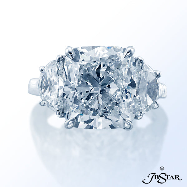 JB STAR DIAMOND RING IN A CLASSICALLY DESIGNED WITH A 6.10 CT CUSHION DIAMOND CENTER EMBRACED BY PER
