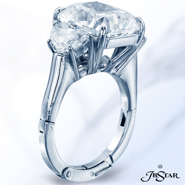 JB STAR DIAMOND RING IN A CLASSICALLY DESIGNED WITH A 6.10 CT CUSHION DIAMOND CENTER EMBRACED BY PER