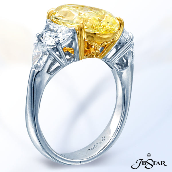 JB STAR NATURAL FANCY YELLOW DIAMOND RING FEATURING A MAGNIFICENT 5.05 CT OVAL FANCY INTENSE YELLOW
