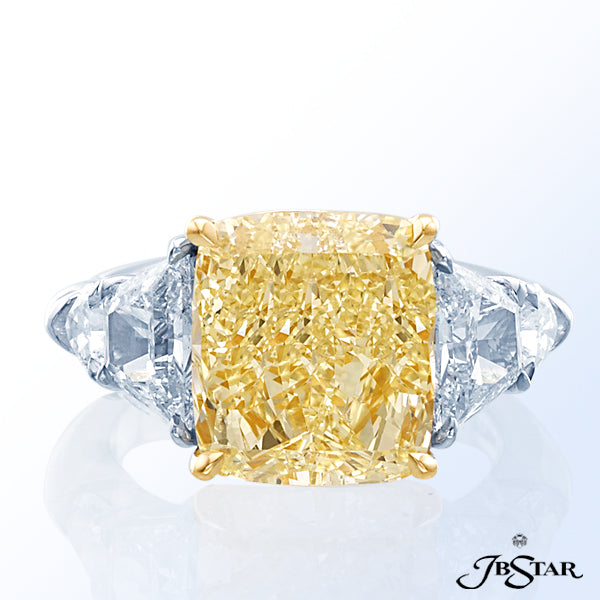 JB STAR NATURAL FANCY YELLOW DIAMOND RING FEATURING AN EXCEPTIONAL 7.04 CT FANCY YELLOW CUSHION DIAM