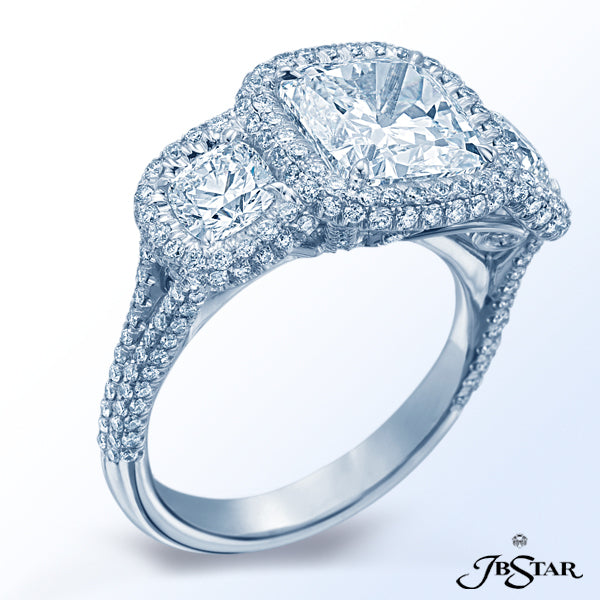 JB STAR DIAMOND RING FEATURING A 3.23 CT CUSHION CENTER EMBRACED BY TWO ADDITIONAL CUSHION DIAMONDS,