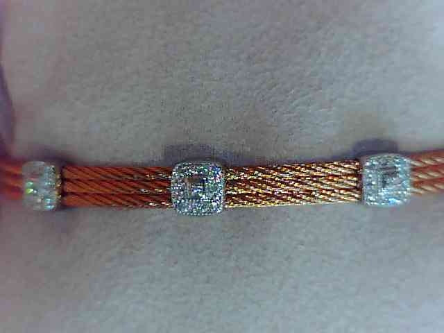 Alor Grey cable 3 row 1.6 mm, 18 karat White Gold, 0.14 total carat weight Diamonds and stainless steel. Imported.