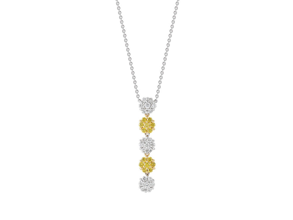 Alor 18 karat White Gold and Yellow Gold with 0.78 total carat weight White and Canary Diamonds on White Gold chain. Imported.