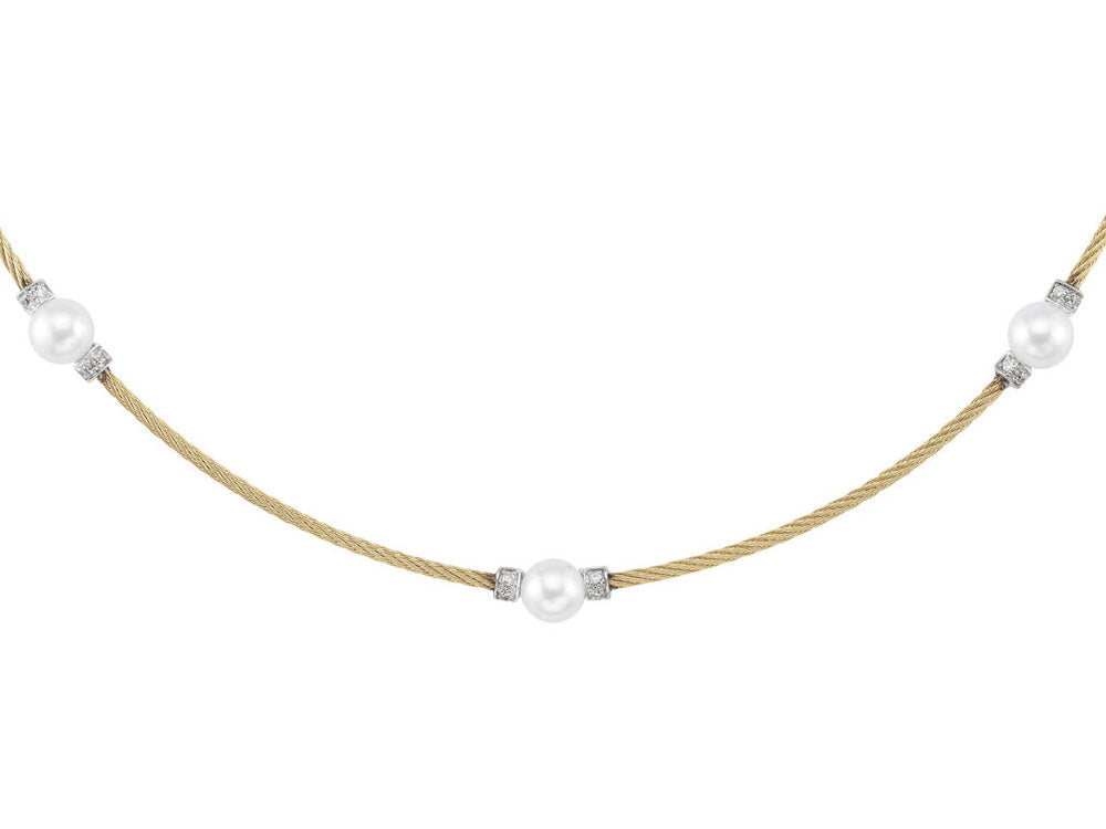 Alor 18 karat White Gold, stainless steel and yellow stainless steel cable with White Freshwater Pearls and 0.11 total carat weight Diamonds. Imported.